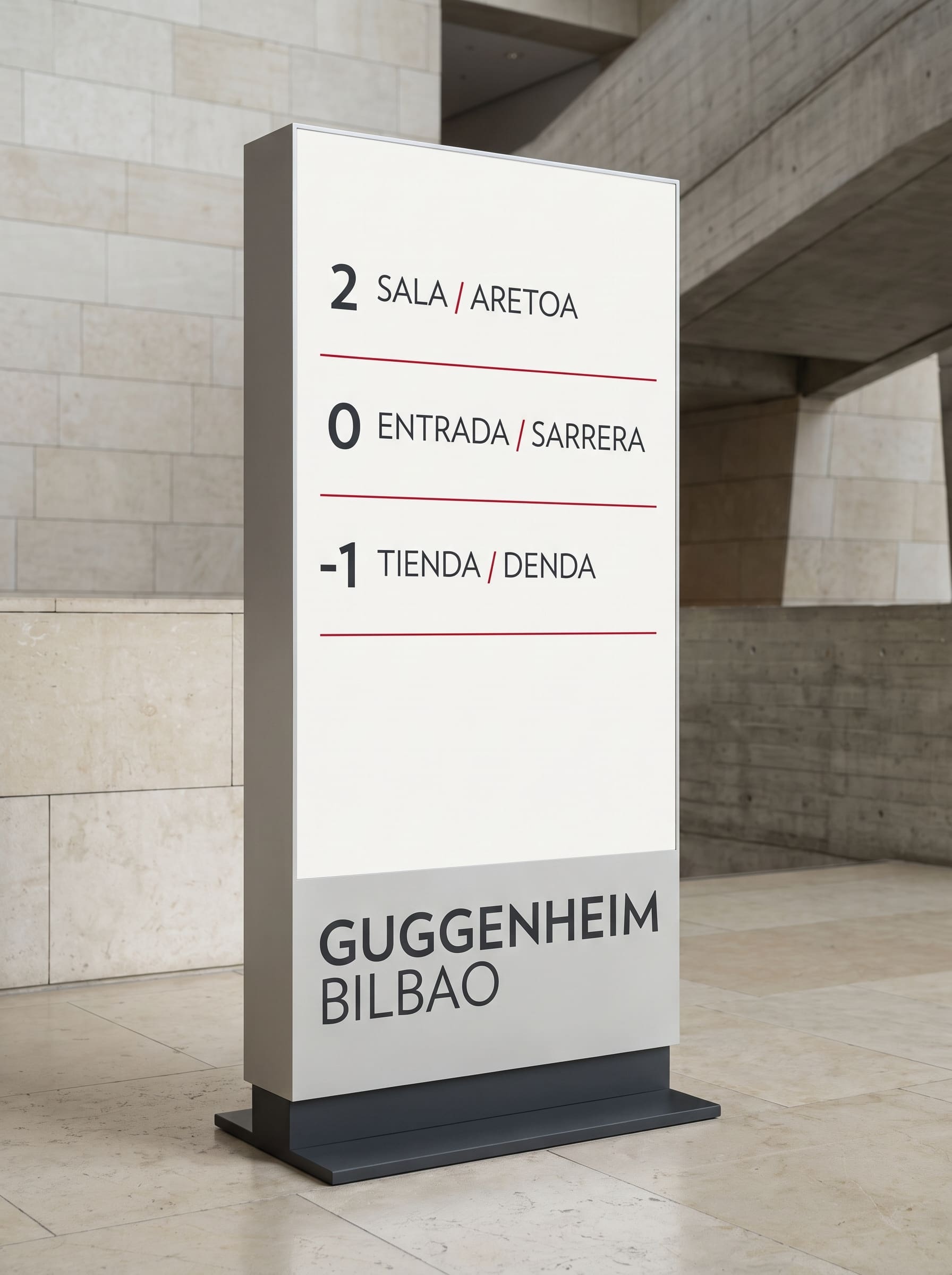 Silver directory totem with white screen listing floors in Spanish and Basque, red hairline rules