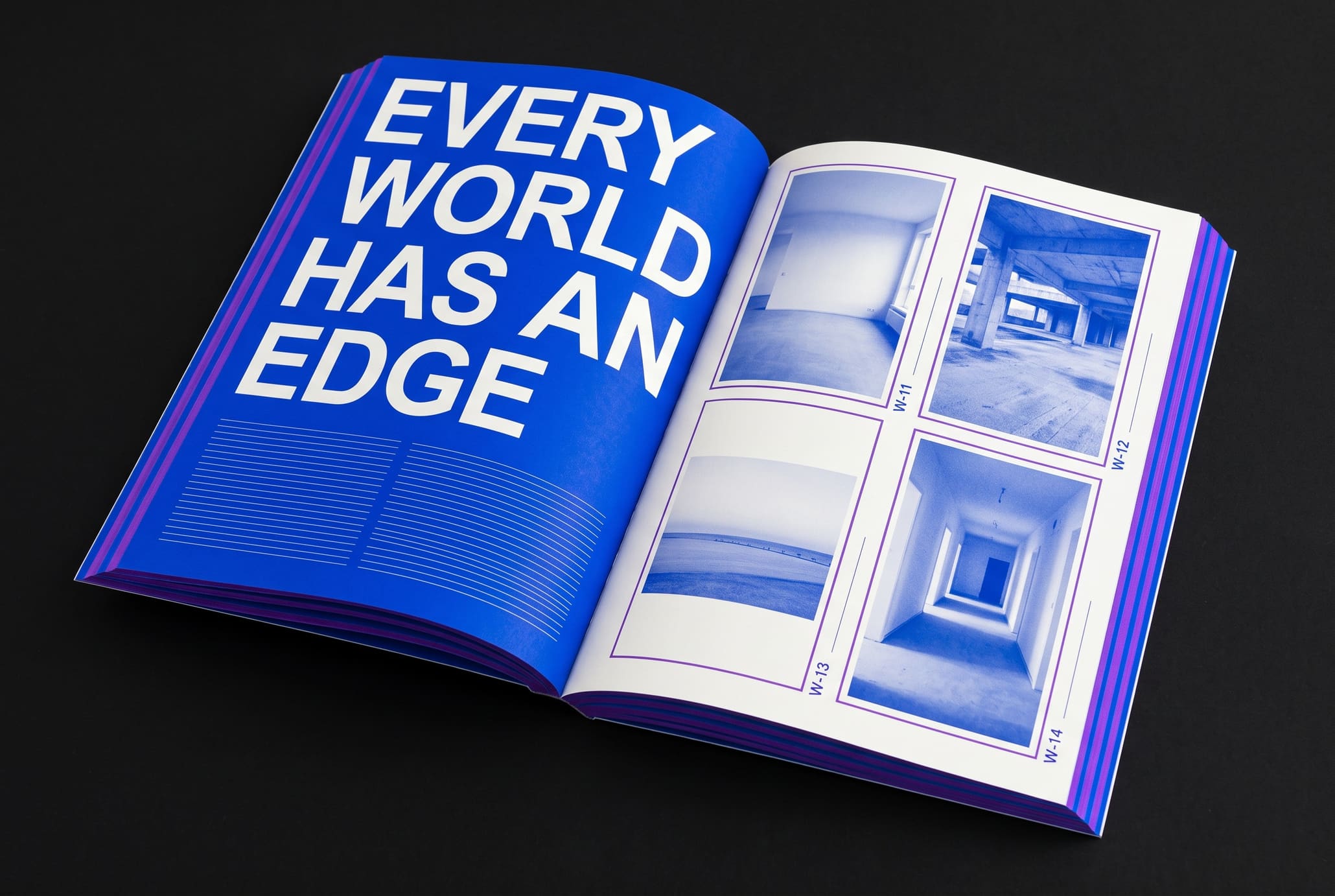 An angled open book with a blue page reading EVERY WORLD HAS AN EDGE beside a grid of framed photographs