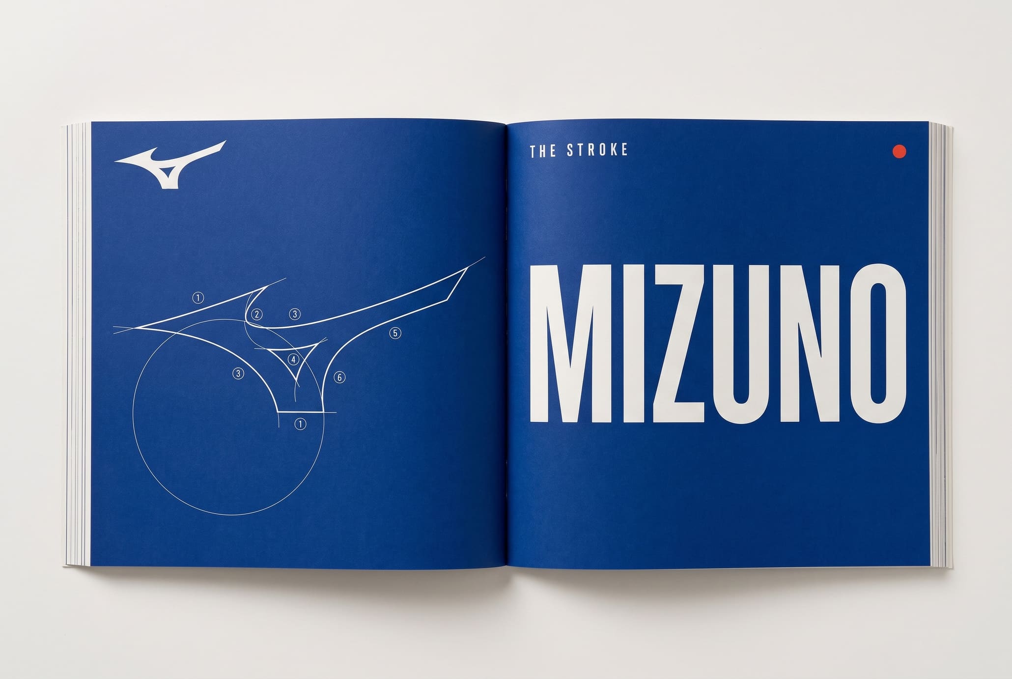 Open blue-printed brand manual spread with a Runbird construction diagram.