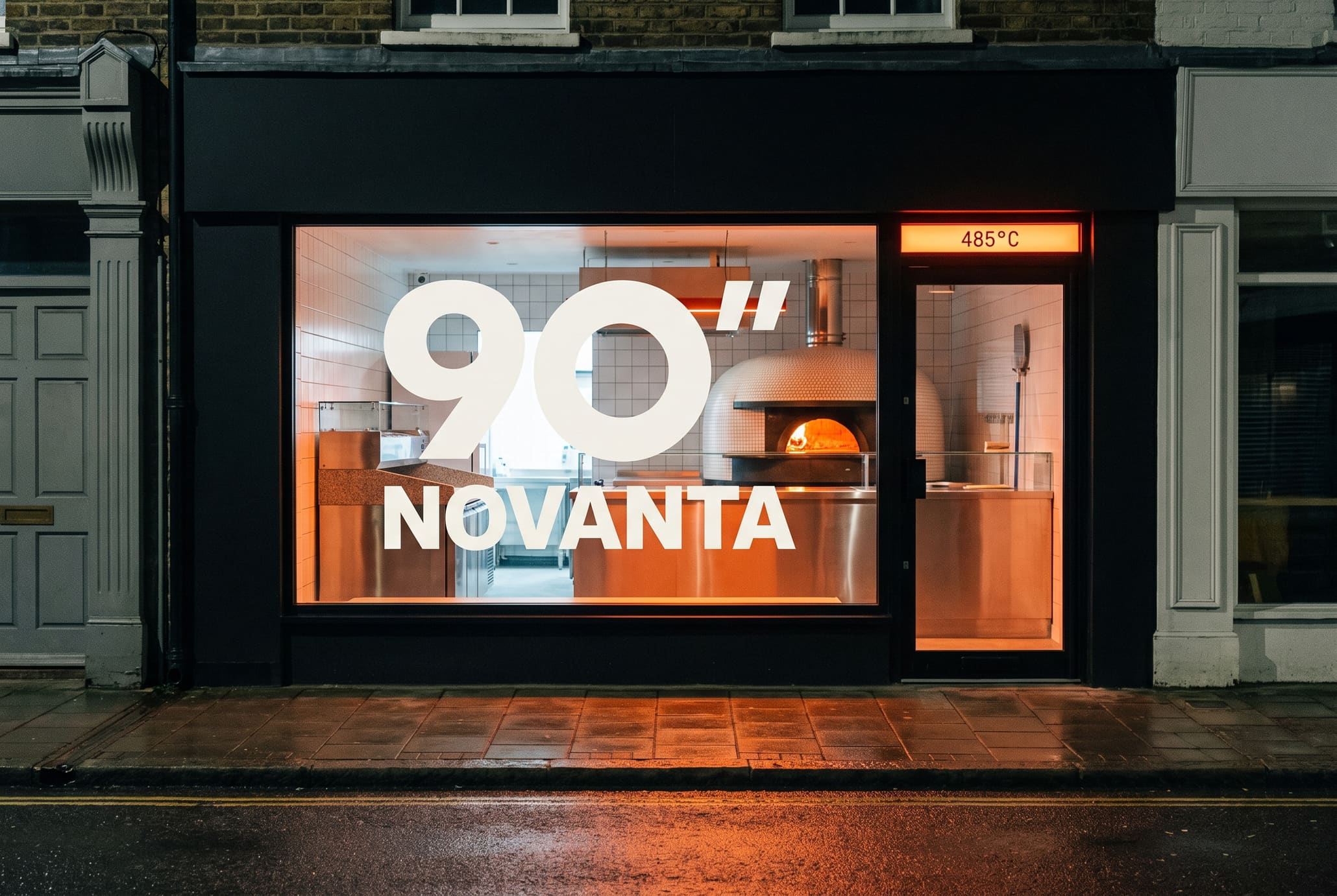 A pizzeria shopfront at night, the 90-seconds mark on the glass, the oven glowing inside