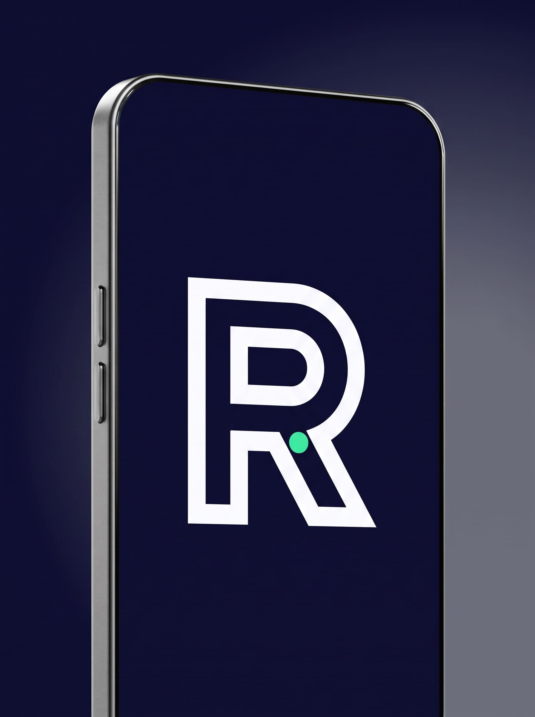 A matte graphite phone at a steep three-quarter angle, its dark indigo screen showing a small cold-white single-stroke R monogram above a hairline mint arc