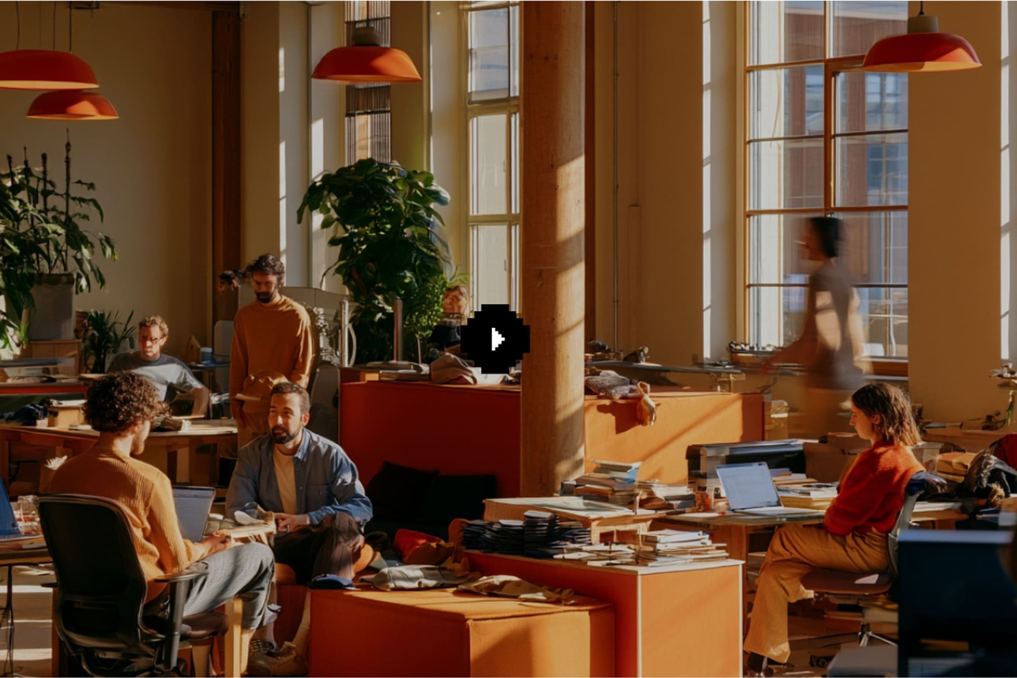 A wide photograph of a working studio floor used as the platform's video still